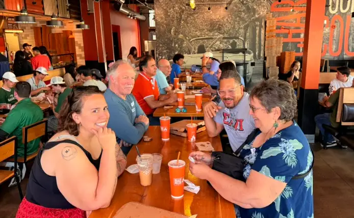 Attendees networking at the IEEE Foothill YP Pi Day Pizza Mixer in Claremont